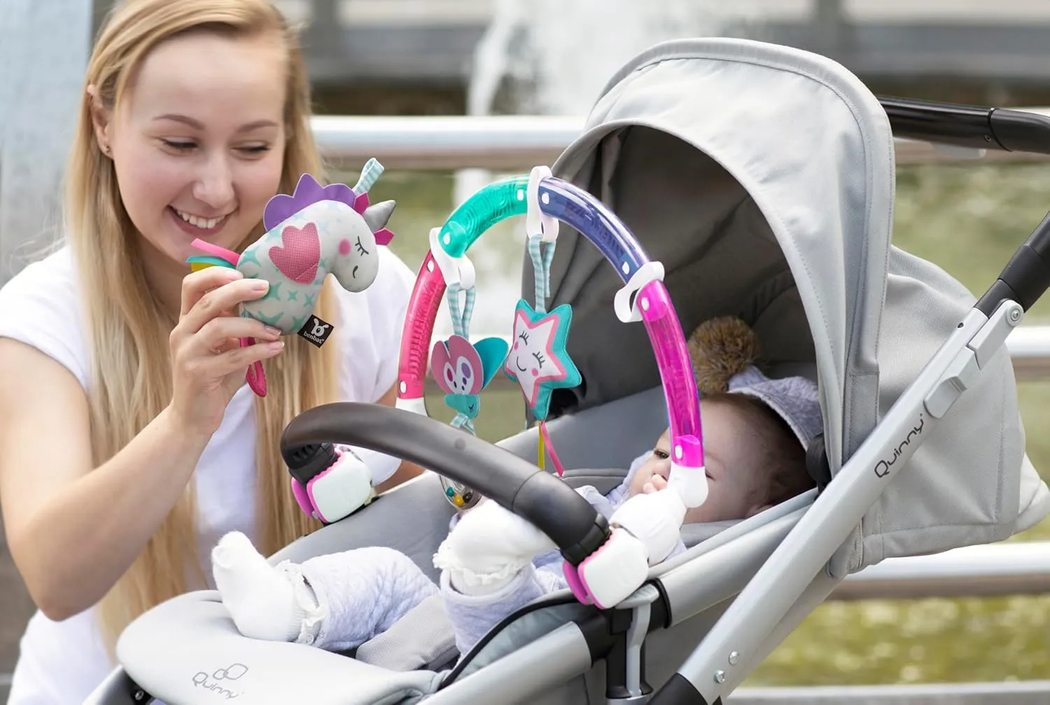 BENBAT Baby Stroller Arch Toy Rainbow Dazzle Friends Play Bar. Fun Newborns Sensory Activity, Adjustable for Bouncers and Car Seat, Unicorn